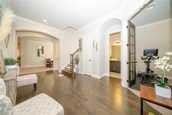 a view of a livingroom with furniture and staircase
