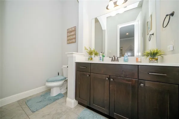a view of a patio with couches table and chairs with wooden floor and fence