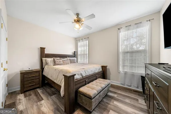 a bedroom with a bed furniture and a window