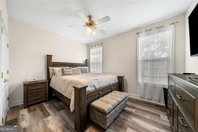 a bedroom with a bed furniture and a window