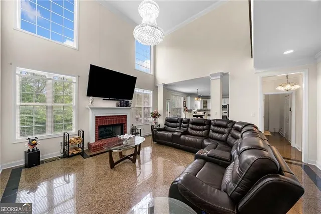 a living room with furniture fireplace and a flat screen tv