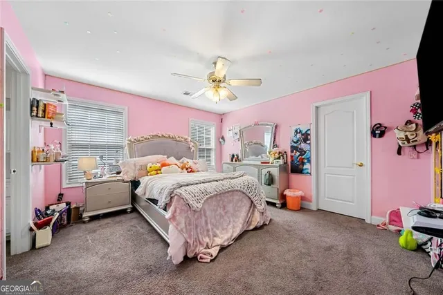 a bed room with a bed and a chandelier