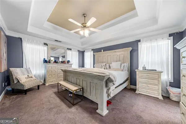 a bed room with a bed and furniture