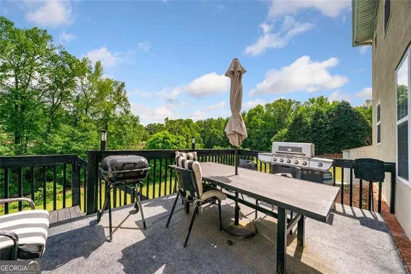a view of a chairs and table in patio