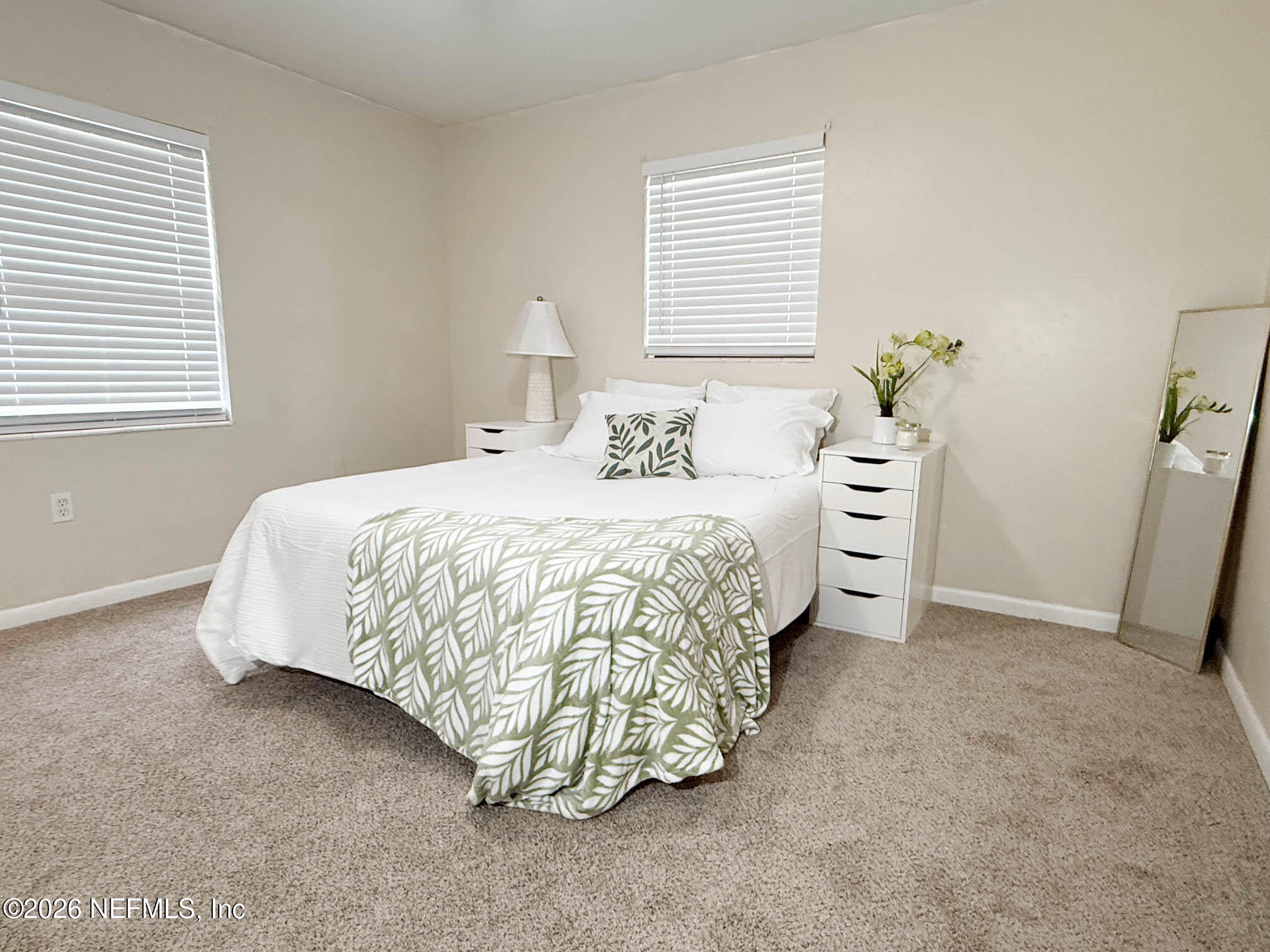 22620 Southeast Hawthorne Road Hawthorne, FL 32640 - Photo 16 of 28 a bedroom with a bed and a window