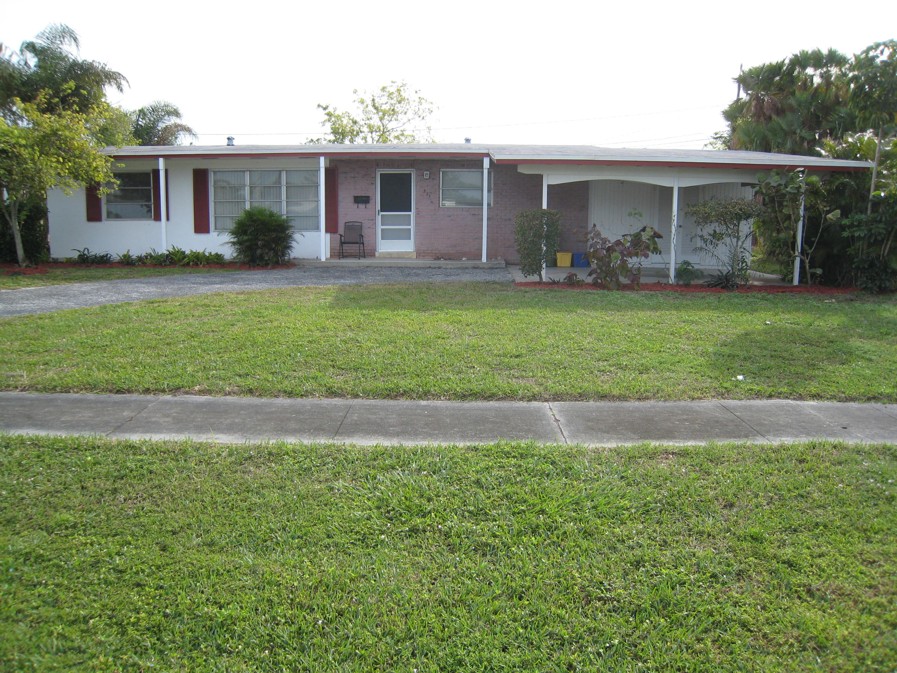 321 Masters Road Lake Worth, FL 33461 - Photo 2 of 21 front 2
