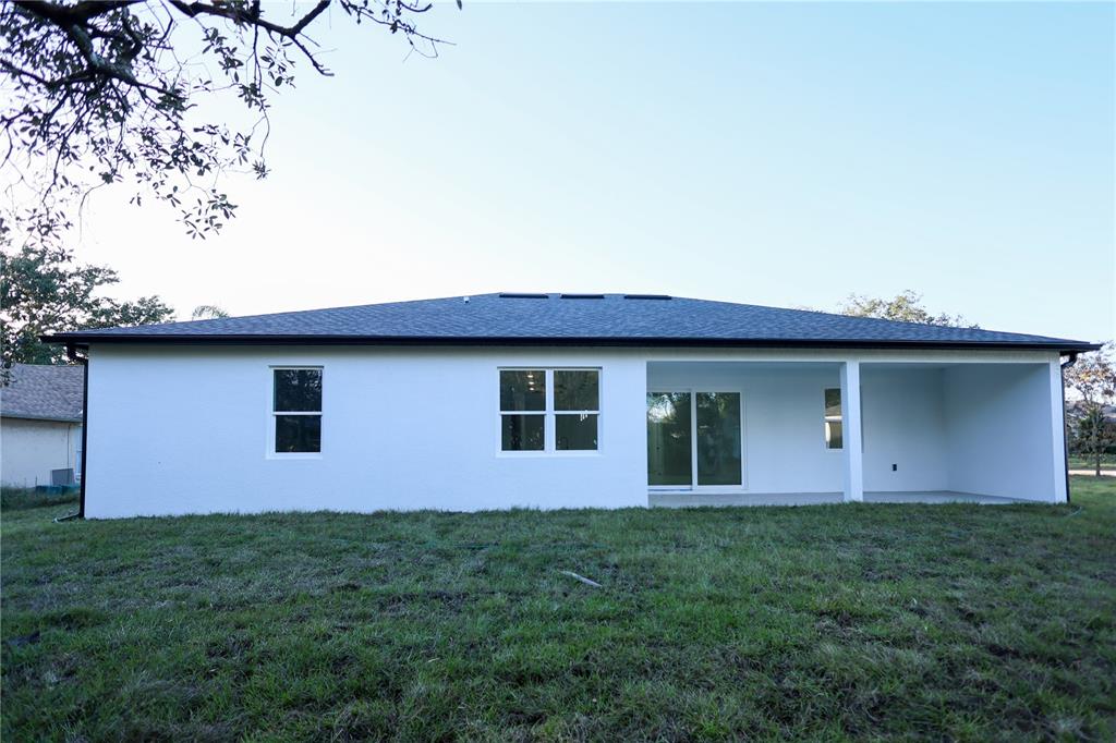 1808 Corolla Court Deltona, FL 32738 - Photo 24 of 29 a front view of house with yard