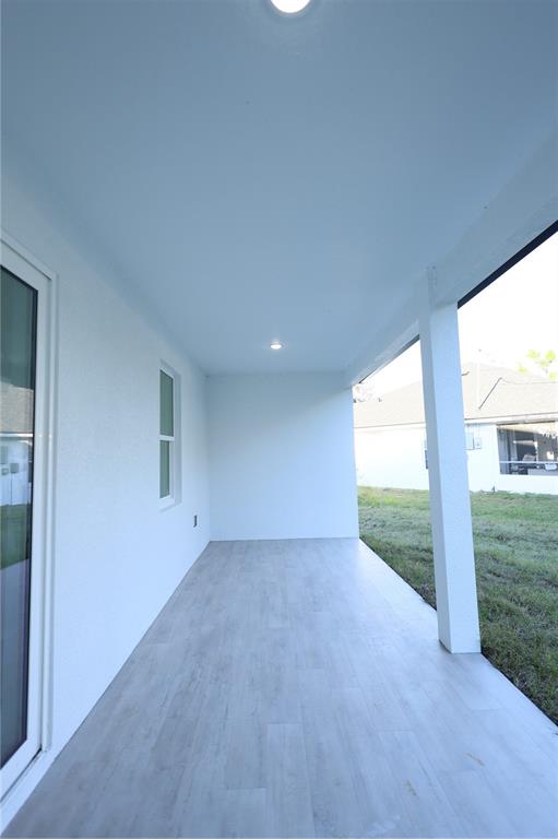 1808 Corolla Court Deltona, FL 32738 - Photo 25 of 29 a view of an empty room with a floor to ceiling window and a yard