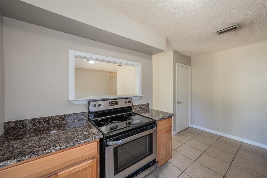 3029 Montclair Place Denton, TX 76209 - Photo 13 of 39 a stove top oven sitting inside of a kitchen