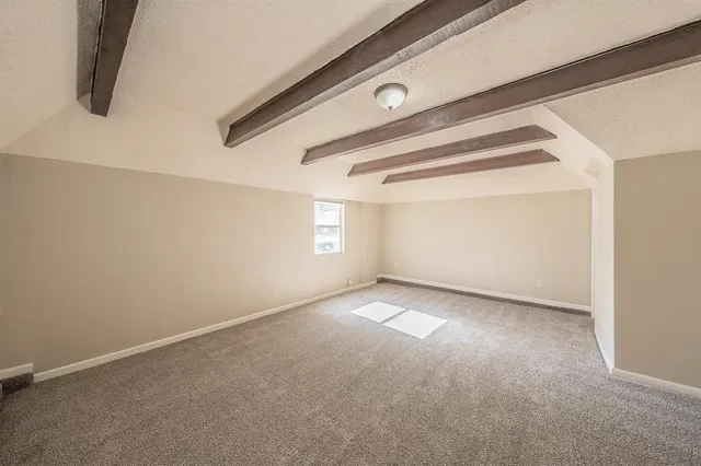 a bathroom with a bathtub shower sink mirror vanity and toilet