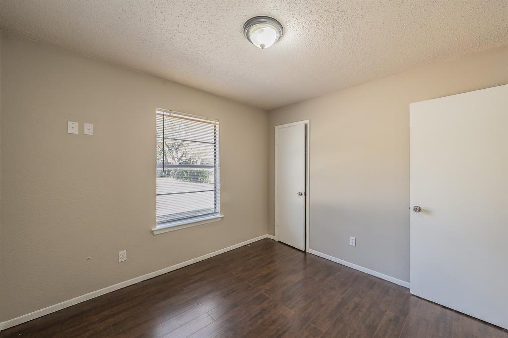 3029 Montclair Place Denton, TX 76209 - Photo 22 of 39 an empty room with wooden floor and windows