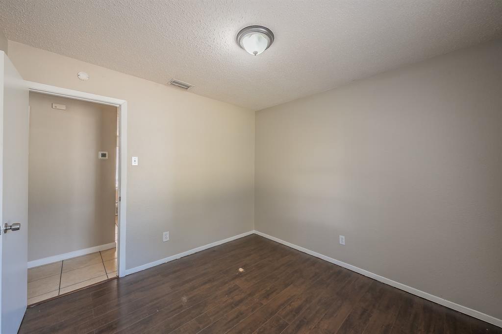 3029 Montclair Place Denton, TX 76209 - Photo 24 of 39 a view of an empty room with wooden floor