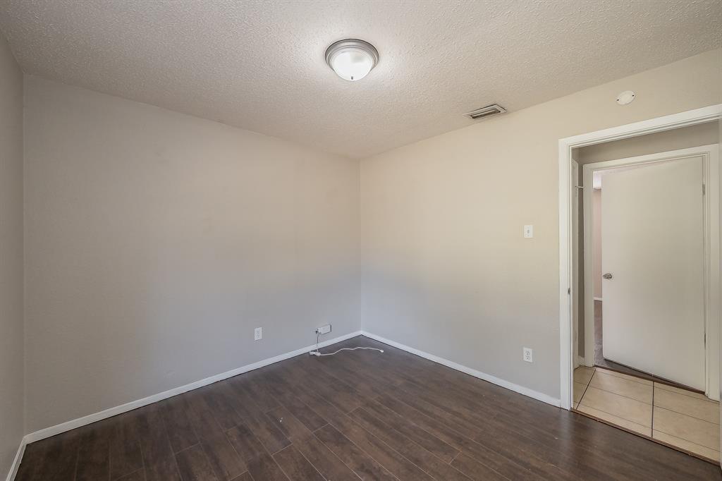 3029 Montclair Place Denton, TX 76209 - Photo 33 of 39 a view of an empty room with wooden floor