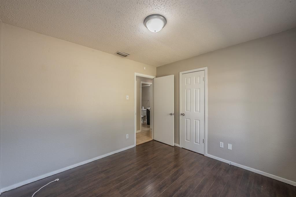 3029 Montclair Place Denton, TX 76209 - Photo 34 of 39 a view of an empty room with wooden floor