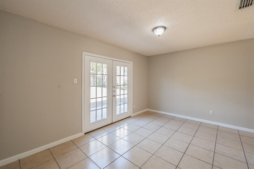 3029 Montclair Place Denton, TX 76209 - Photo 9 of 39 a view of an empty room with a window