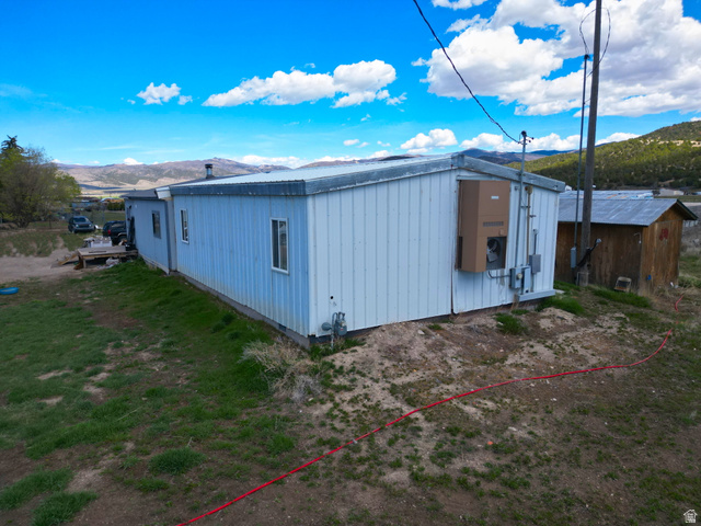 34030 North 7905th East Fairview, UT 84629 - Photo 5 of 30 View of side of home featuring a mountain view