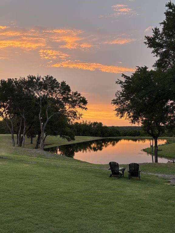 4251 Refuge Road Sherman, TX 75092 - Photo 17 of 40 a view of a lake with houses in the back