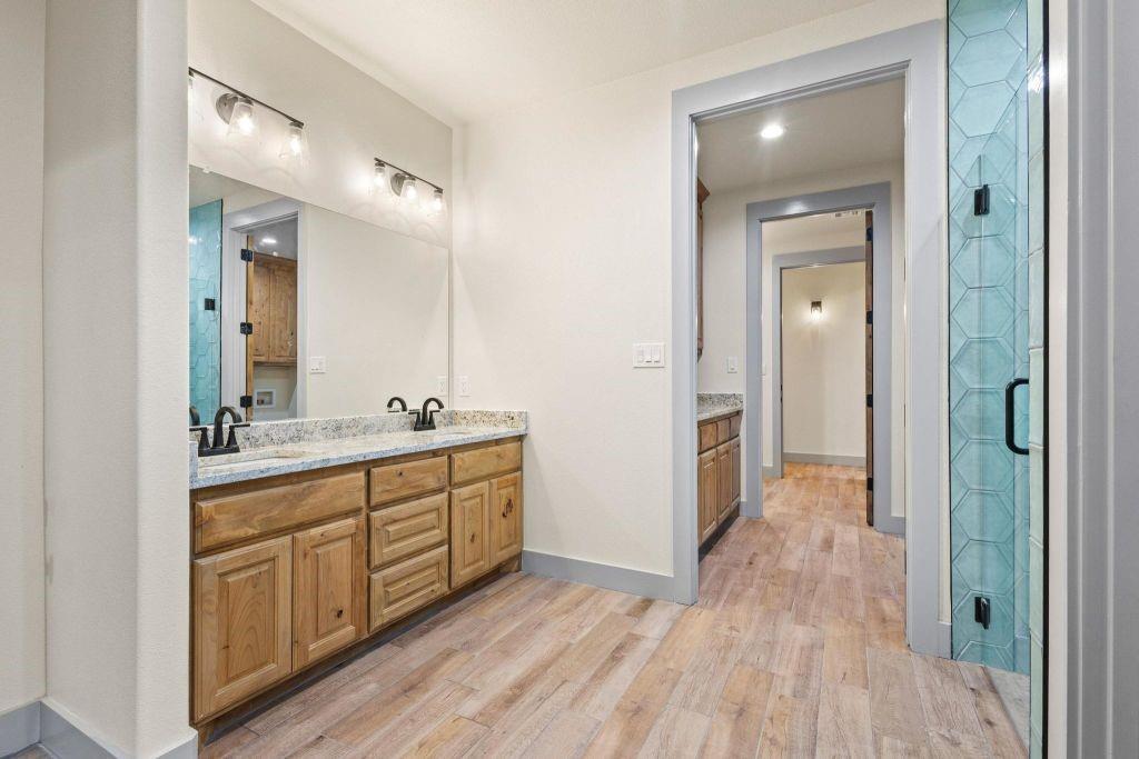4251 Refuge Road Sherman, TX 75092 - Photo 24 of 40 a bathroom with a sink and a mirror