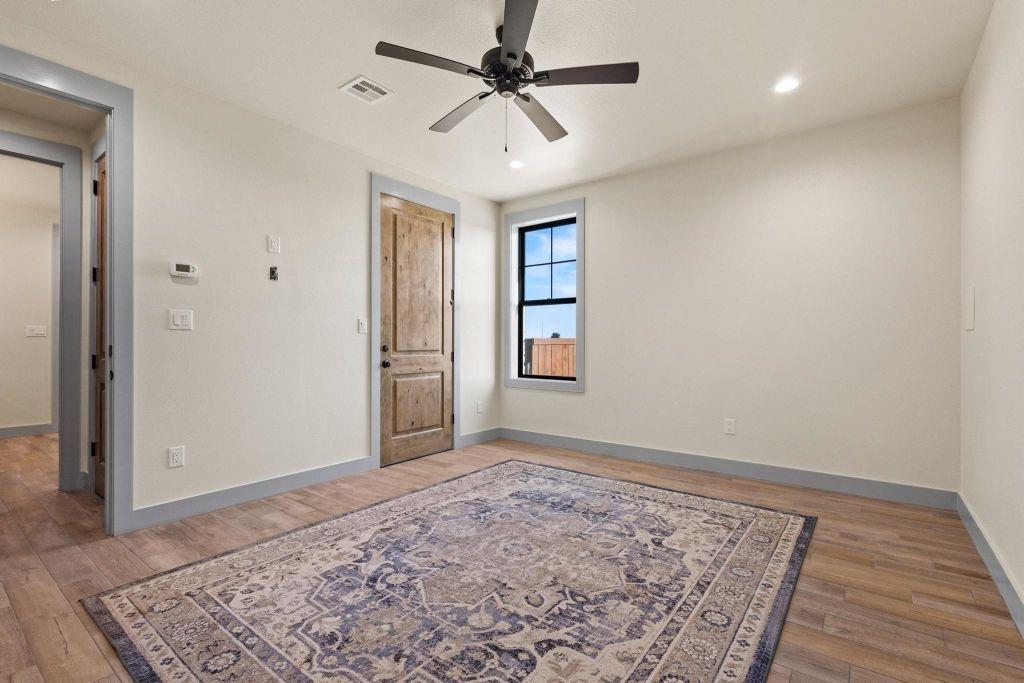 4251 Refuge Road Sherman, TX 75092 - Photo 26 of 40 wooden floor in an empty room with a window