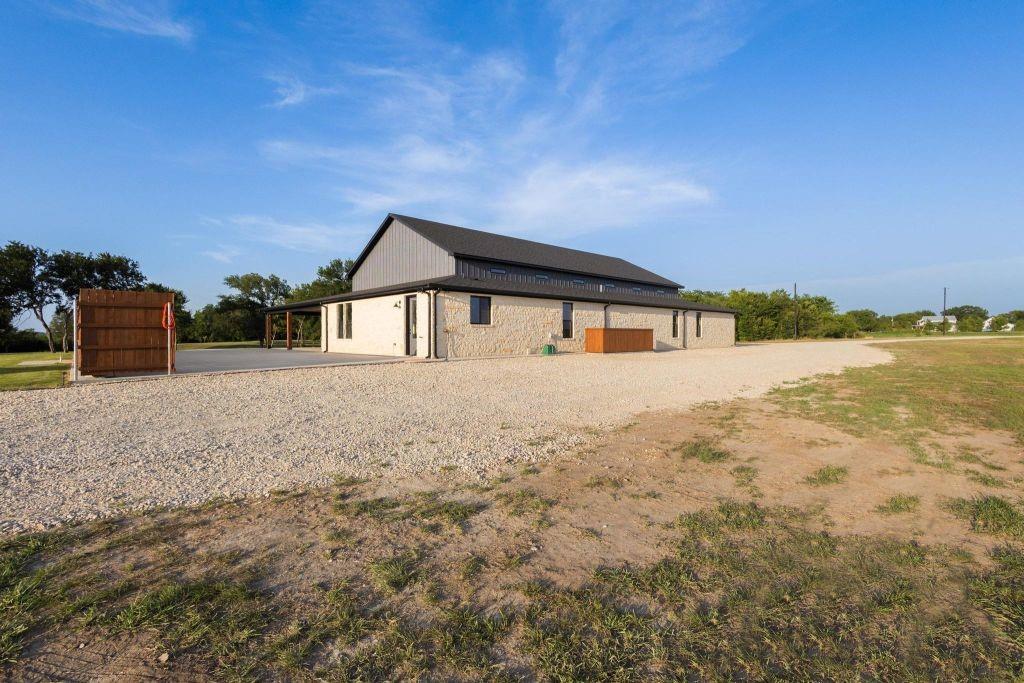 4251 Refuge Road Sherman, TX 75092 - Photo 32 of 40 a house view with a garden space