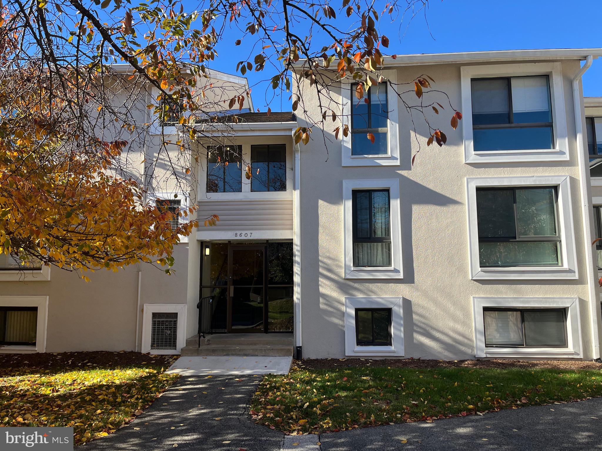 8607 Village Way, Unit 7/8607F Alexandria, VA 22309 - Photo 1 of 30 a front view of a house with a yard