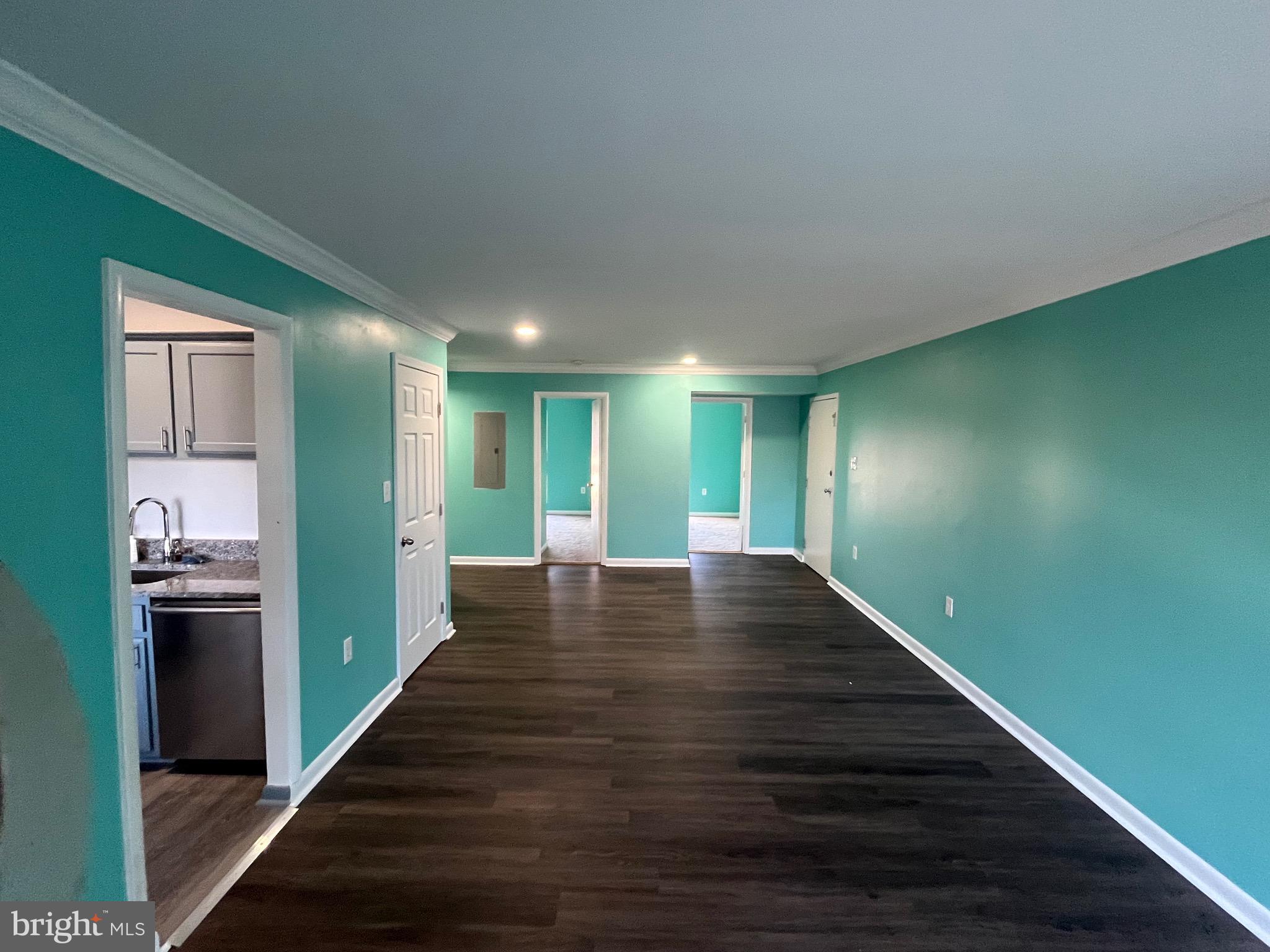8607 Village Way, Unit 7/8607F Alexandria, VA 22309 - Photo 2 of 30 a view of a hallway with wooden floor and a kitchen