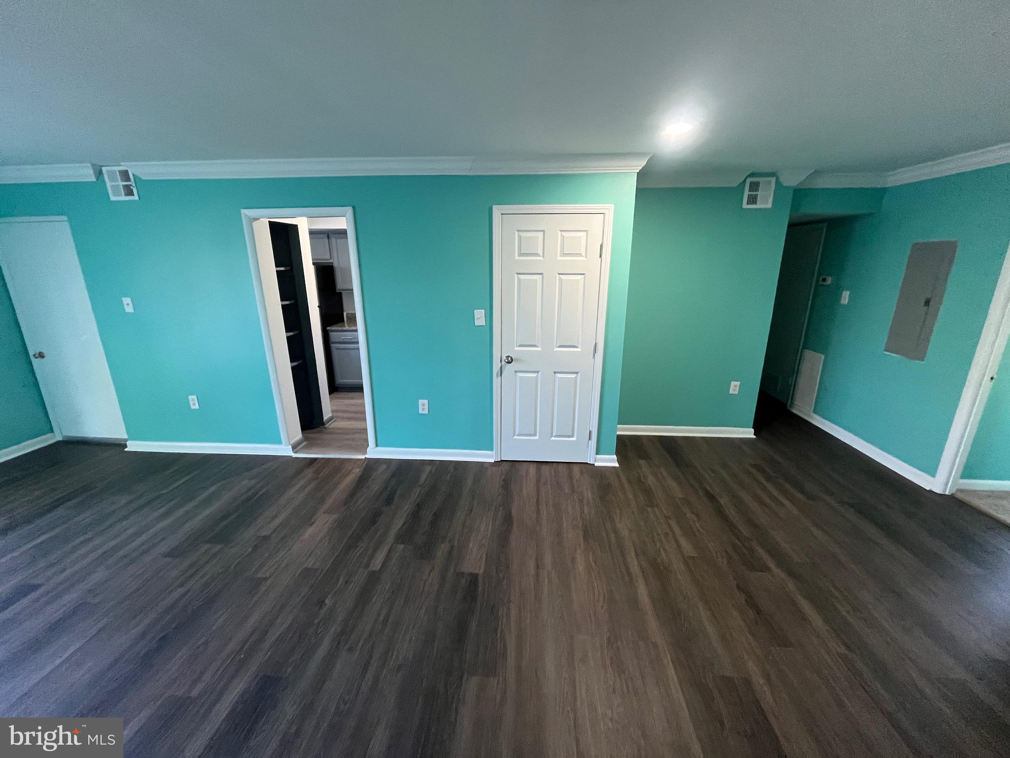 8607 Village Way, Unit 7/8607F Alexandria, VA 22309 - Photo 21 of 30 an empty room with wooden floor and windows