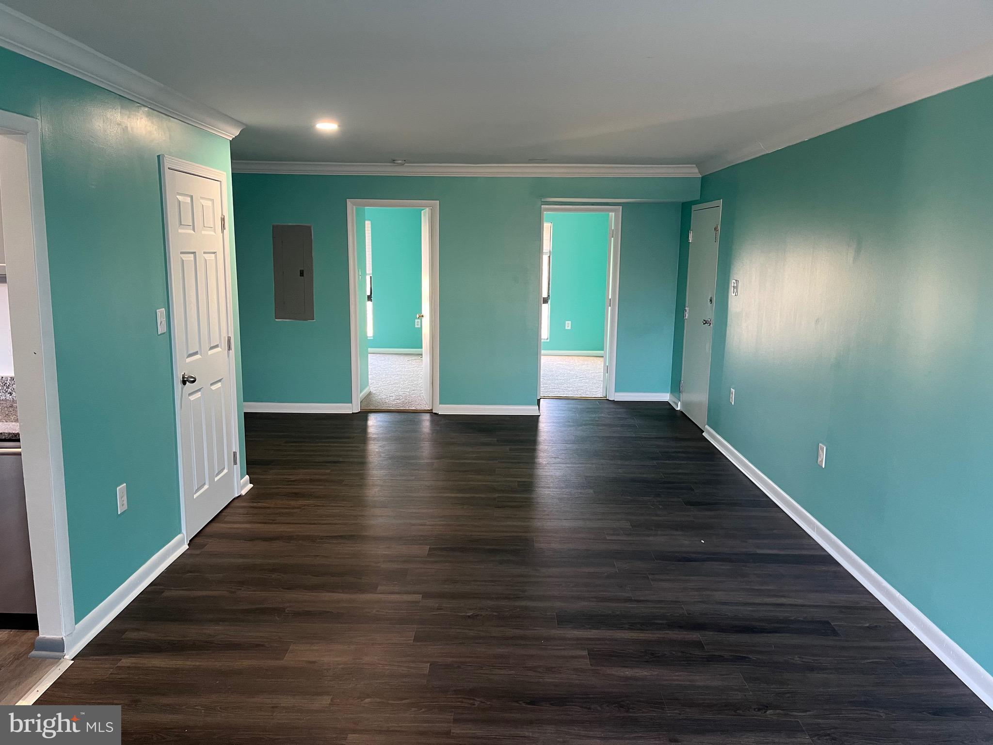 8607 Village Way, Unit 7/8607F Alexandria, VA 22309 - Photo 23 of 30 a view of an empty room with wooden floor and a bathroom