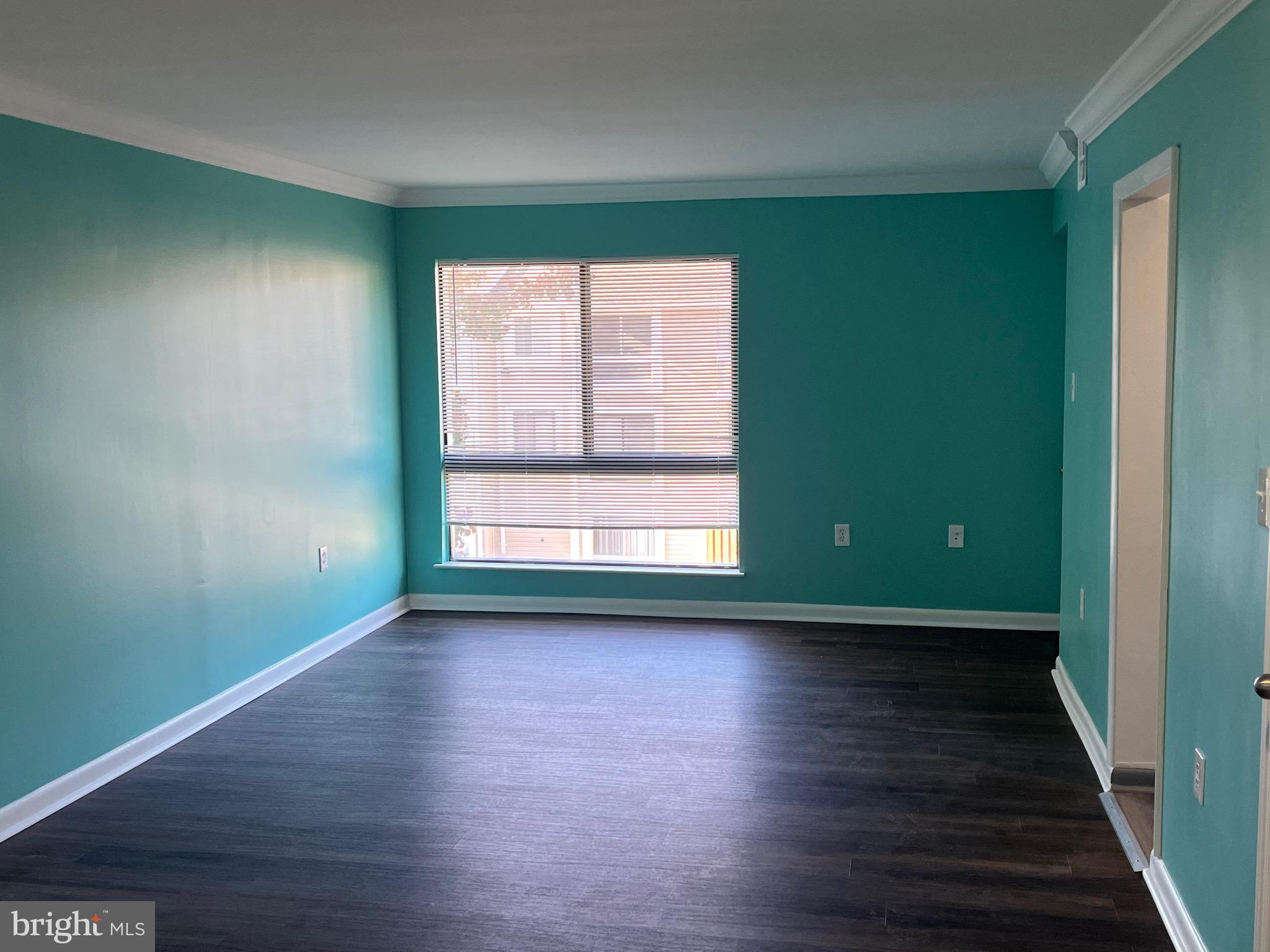 8607 Village Way, Unit 7/8607F Alexandria, VA 22309 - Photo 6 of 30 a view of a room with wooden floor and a window