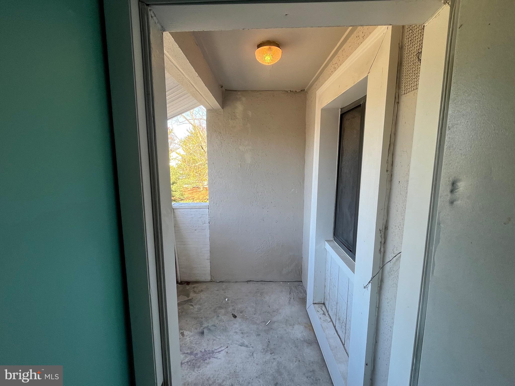 8607 Village Way, Unit 7/8607F Alexandria, VA 22309 - Photo 7 of 30 a view of a hallway with windows