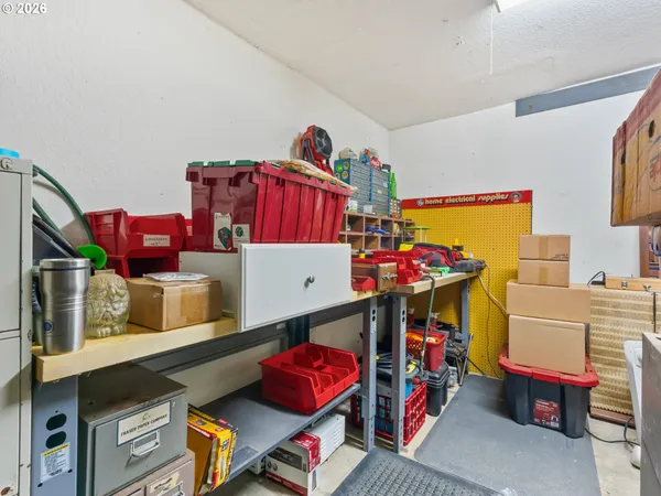 a utility room with dryer and toys