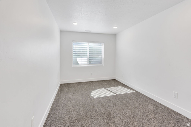 252 North Sunrise Rnch Drive Mapleton, UT 84664 - Photo 46 of 62 Interior room featuring neutral wall finishes, gray carpeting, a window with horizontal blinds, recessed lighting, and white baseboards