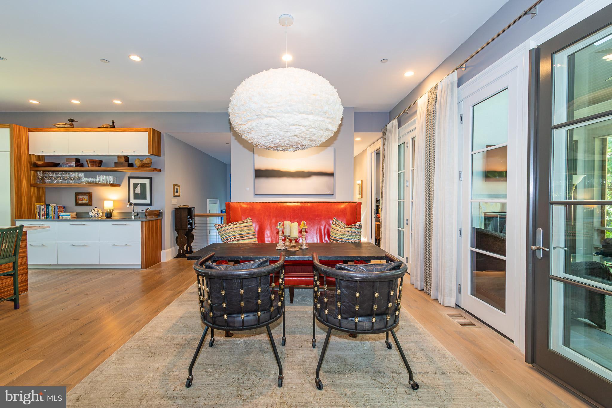 1004 Moss Haven Court Annapolis, MD 21403 - Photo 17 of 77 a view of a dining room with furniture and wooden floor
