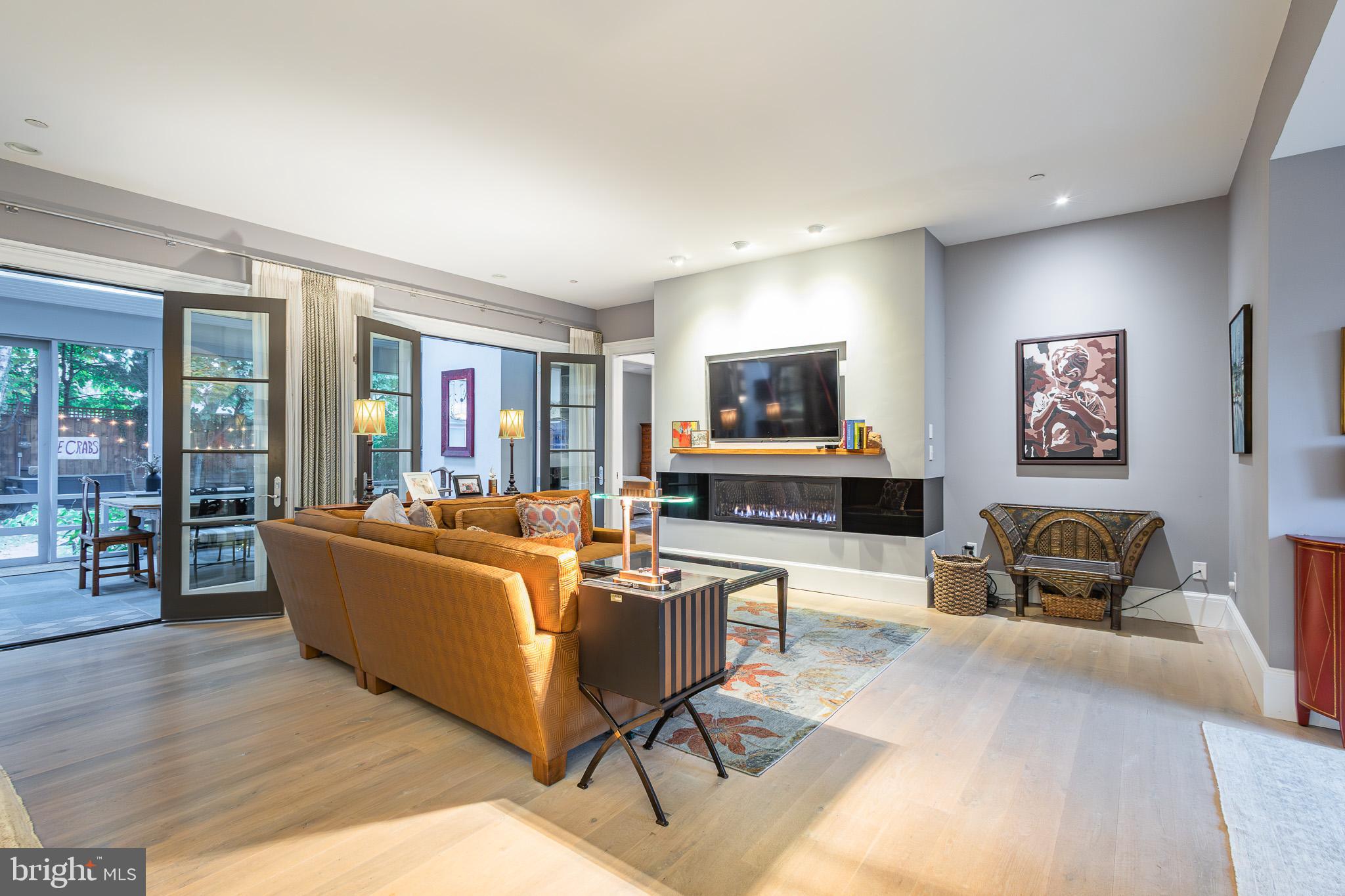 1004 Moss Haven Court Annapolis, MD 21403 - Photo 18 of 77 a living room with furniture and a flat screen tv