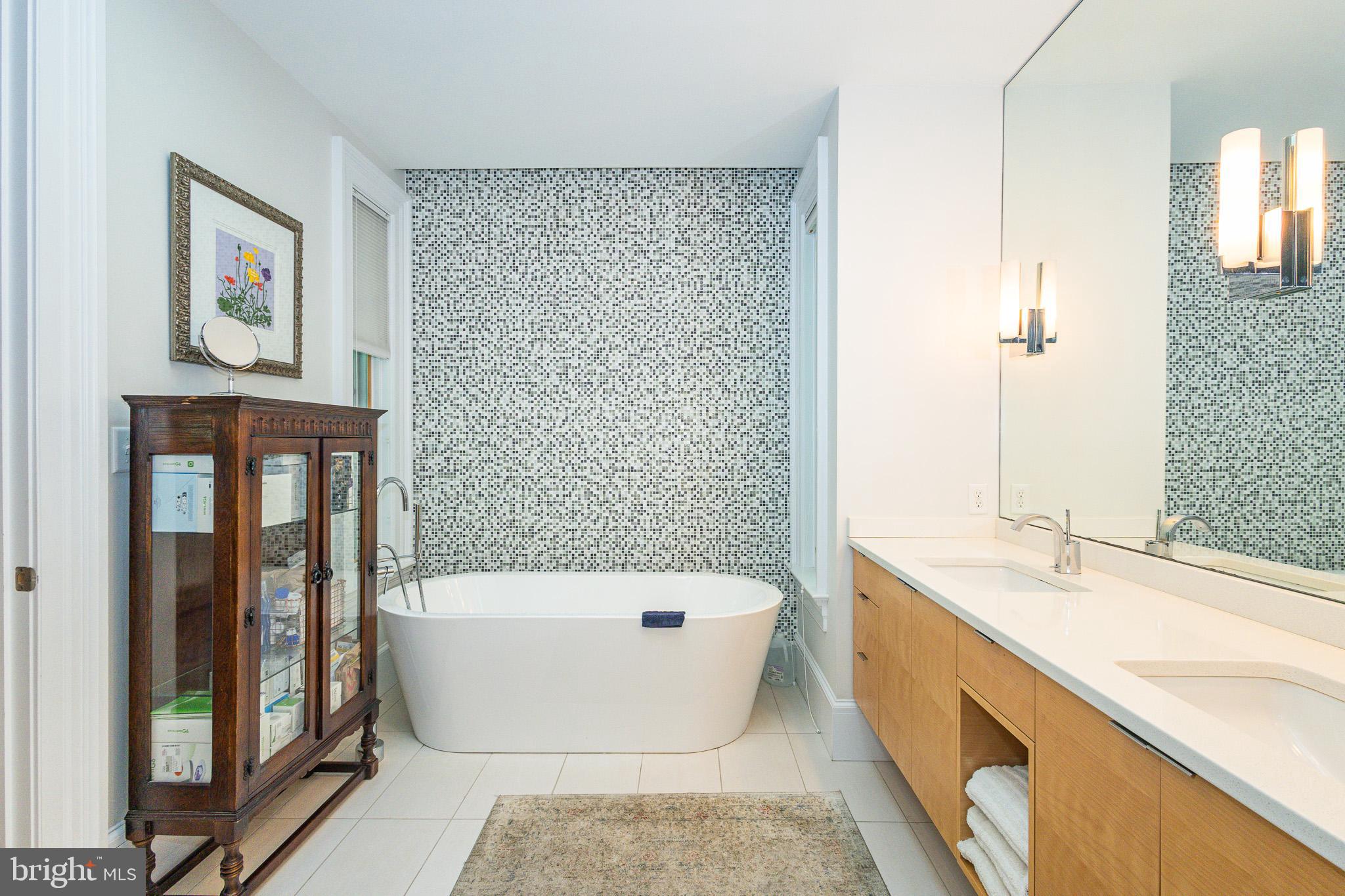 1004 Moss Haven Court Annapolis, MD 21403 - Photo 36 of 77 a bathroom with a bathtub and a sink