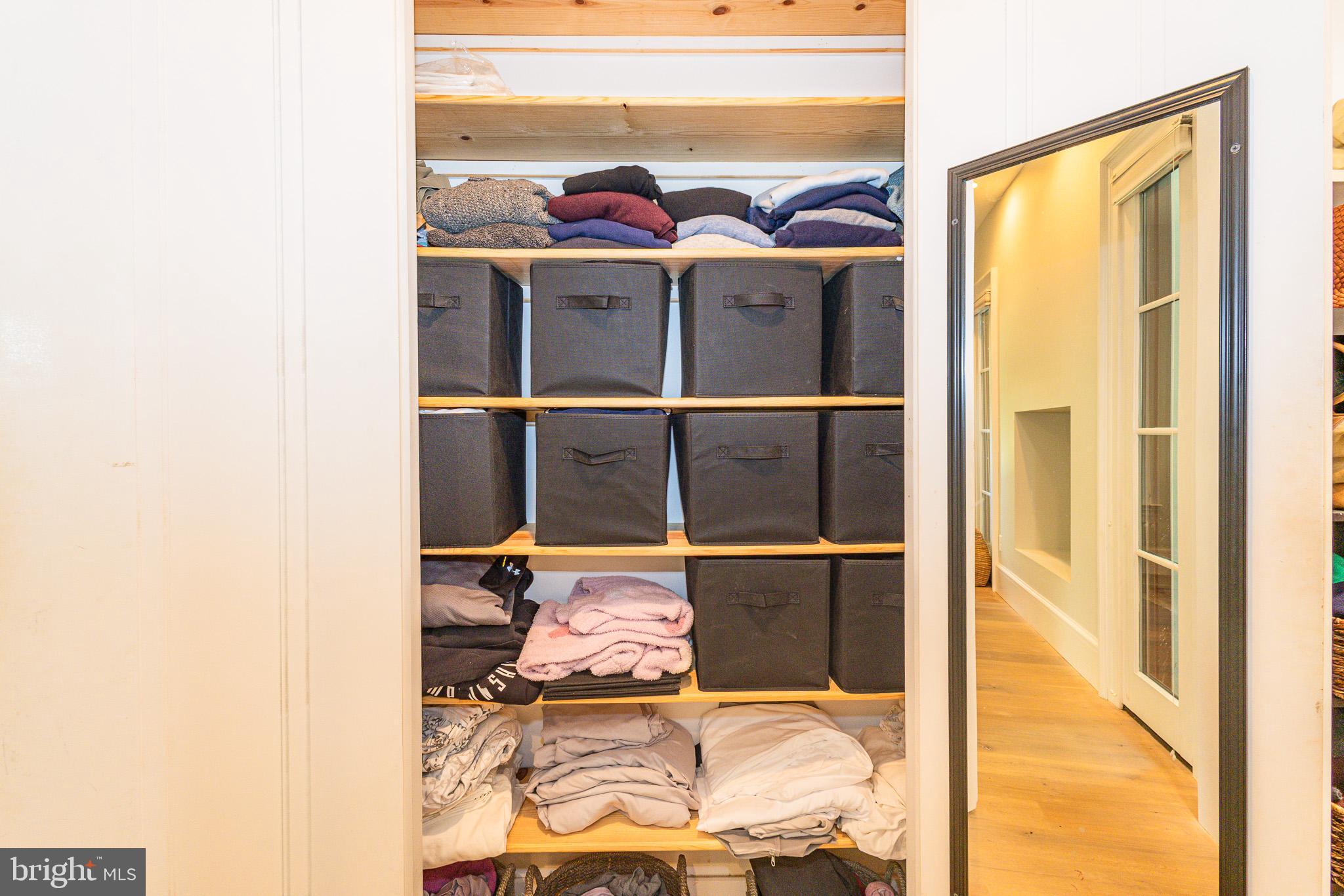 1004 Moss Haven Court Annapolis, MD 21403 - Photo 40 of 77 a bed room with a bed and a painting on the wall