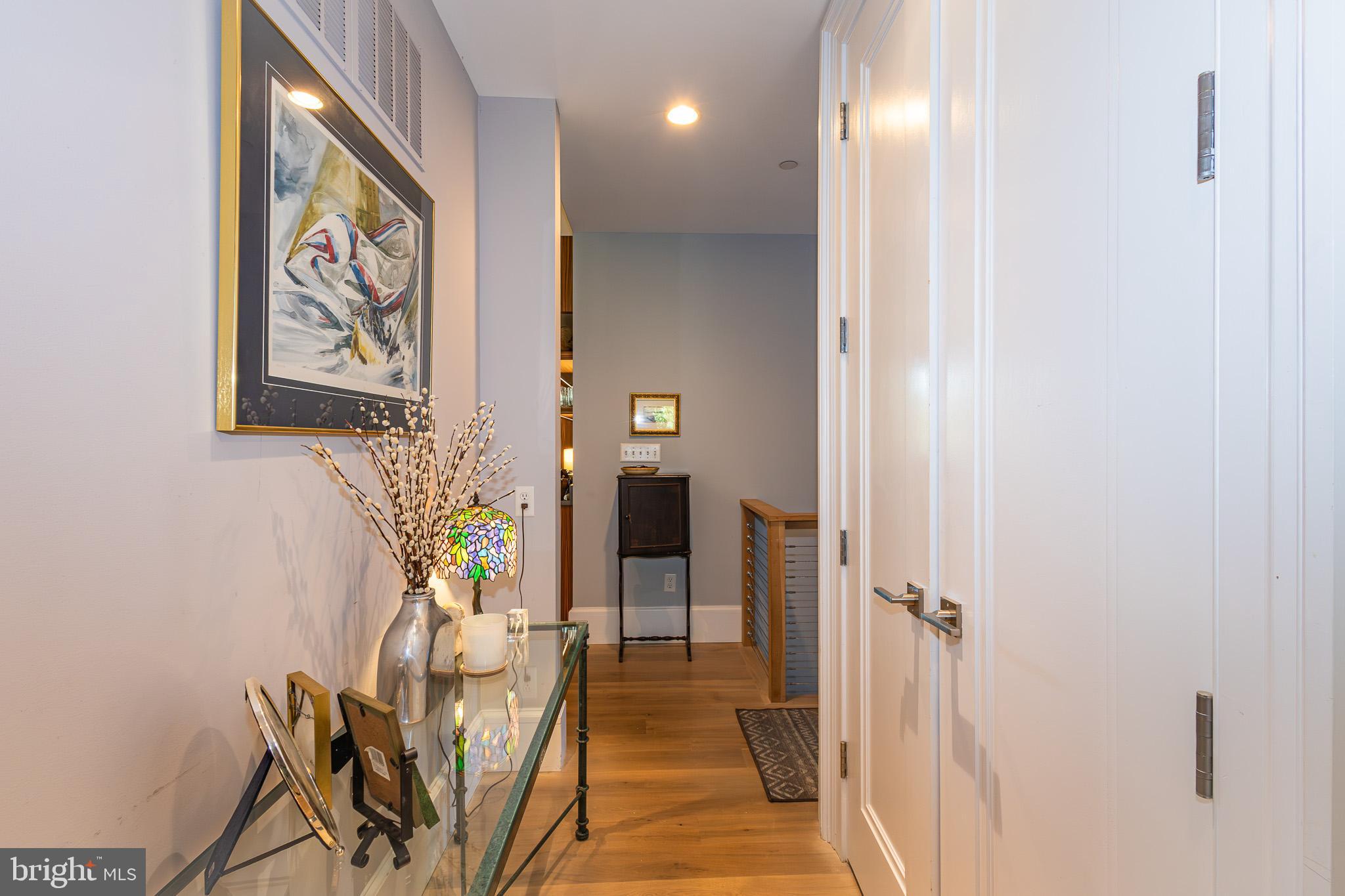 1004 Moss Haven Court Annapolis, MD 21403 - Photo 52 of 77 a view of a hallway to a livingroom with furniture