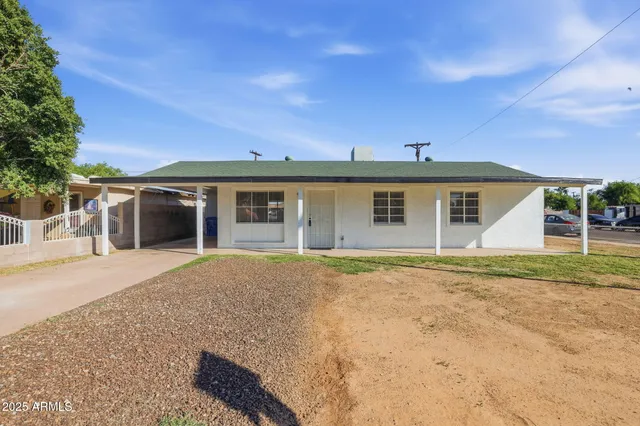 front view of a house with a yard