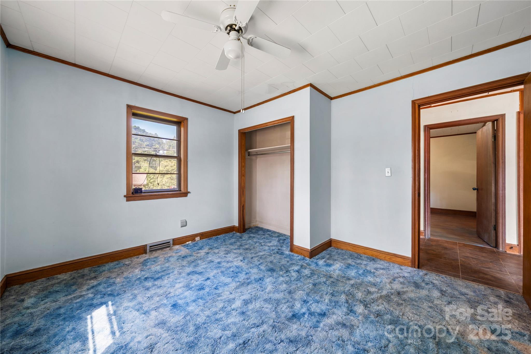 505 Rogers Lake Road East Kannapolis, NC 28083 - Photo 12 of 33 a view of an empty room with window and chandelier fan