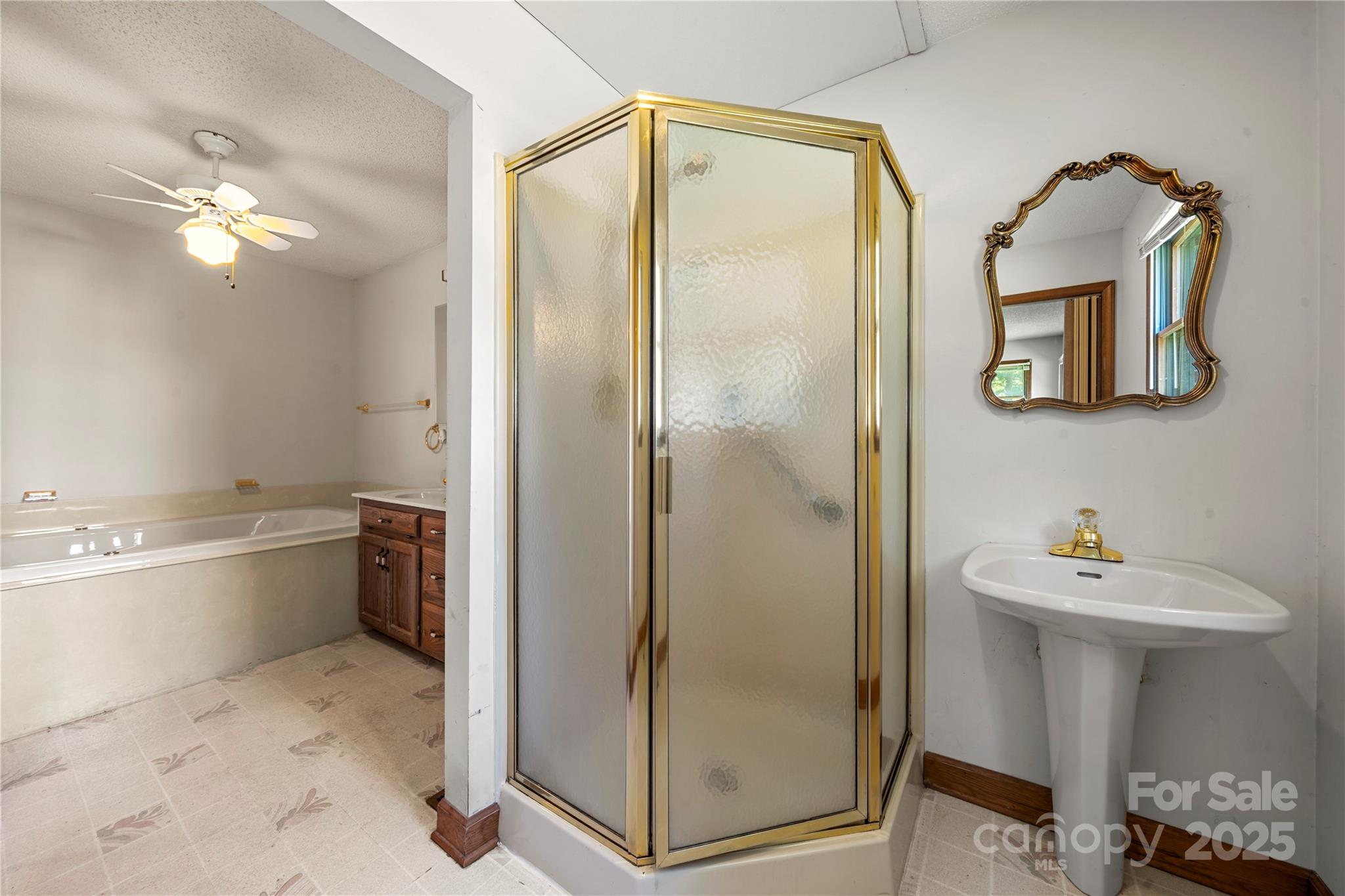 505 Rogers Lake Road East Kannapolis, NC 28083 - Photo 23 of 33 a bathroom with a tub sink and mirror
