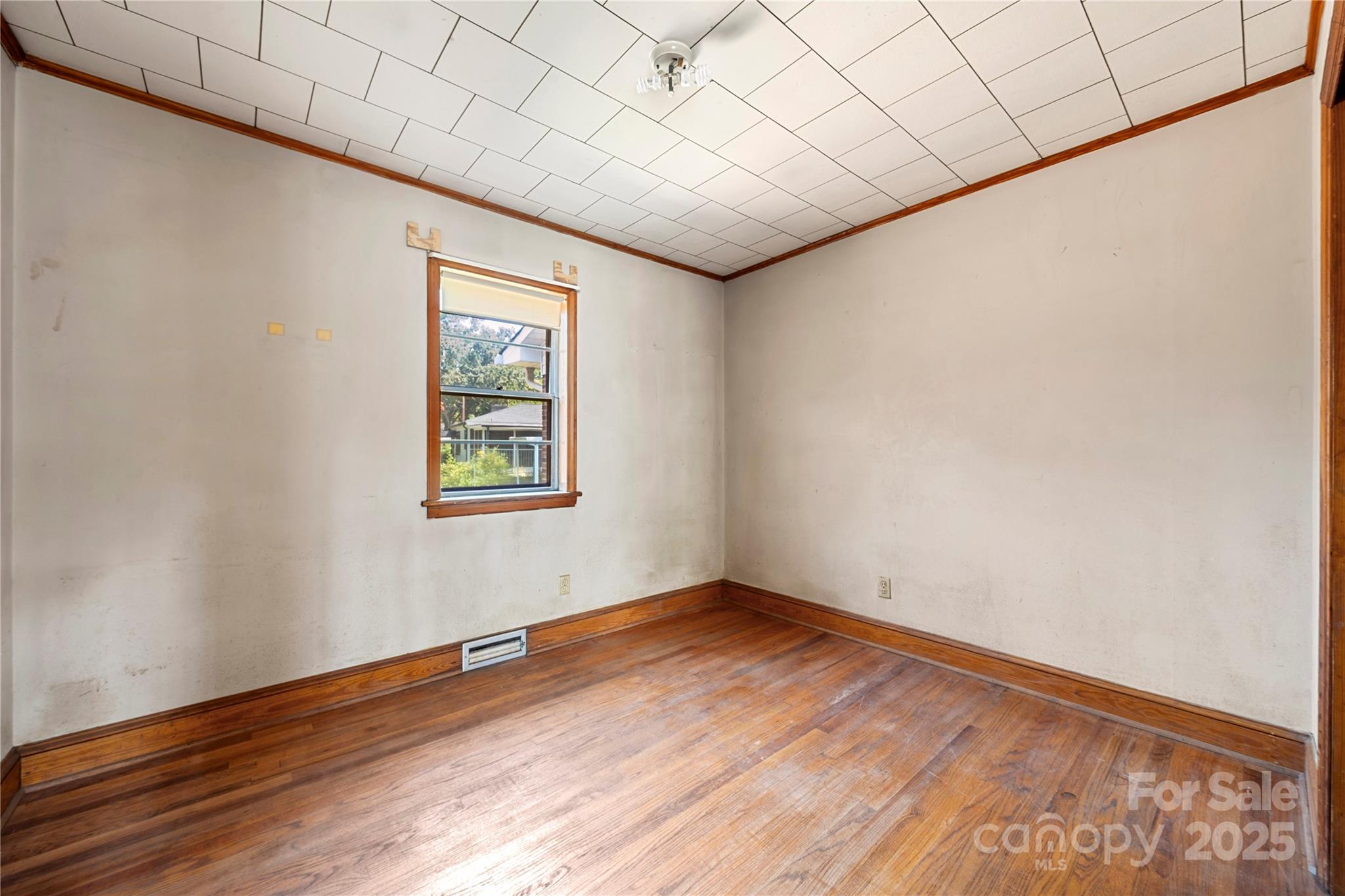 505 Rogers Lake Road East Kannapolis, NC 28083 - Photo 27 of 33 a view of an empty room with wooden floor and a window
