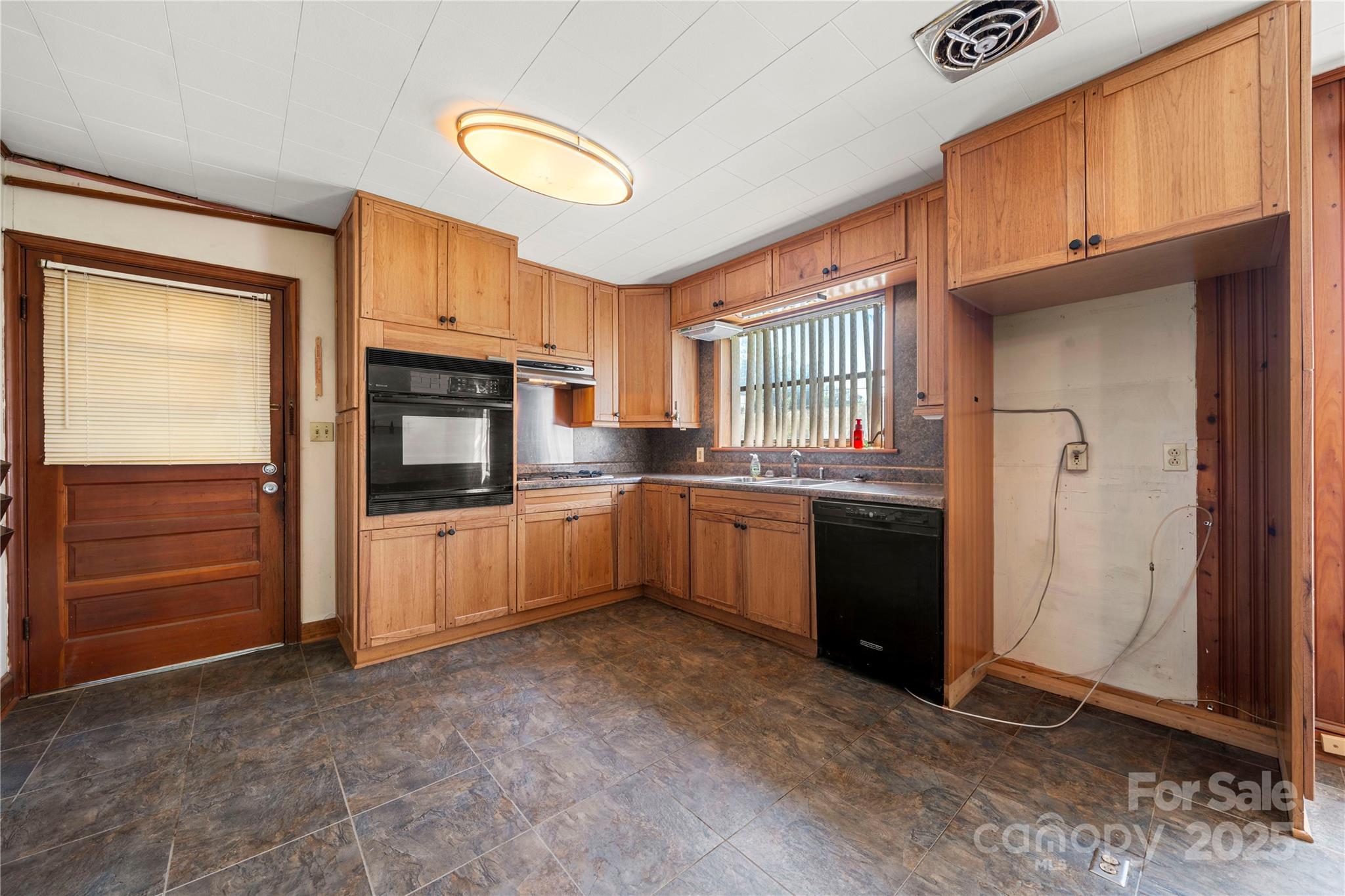 505 Rogers Lake Road East Kannapolis, NC 28083 - Photo 9 of 33 a kitchen with stainless steel appliances a refrigerator and cabinets