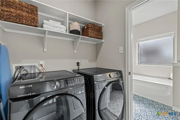 a utility room with dryer and washer