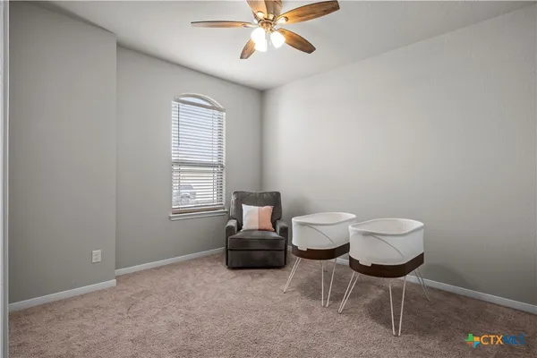a living room with furniture and a window