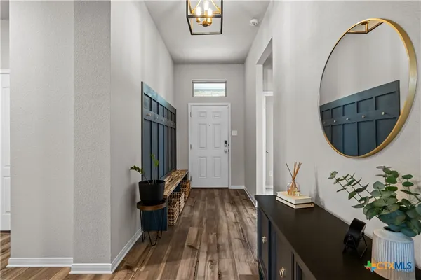 a view of a livingroom with furniture and entryway