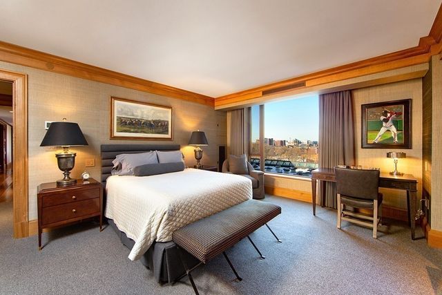 a bedroom with a bed and a couch