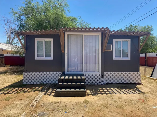 a view of a two chairs in the patio