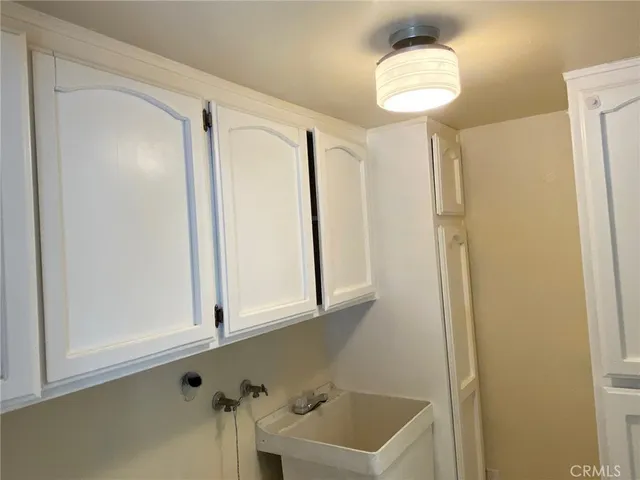 a bathroom with a sink a mirror and a shower