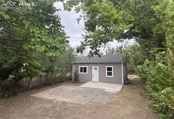 a house with trees in front of it
