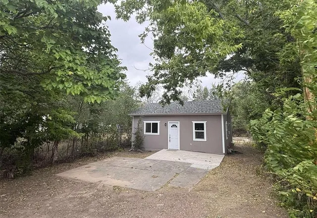 a house with trees in front of it